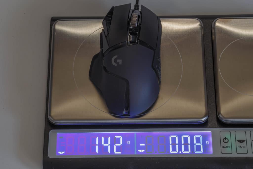 Logitech G502 HERO High Performance Gaming Mouse on scale with weights 
