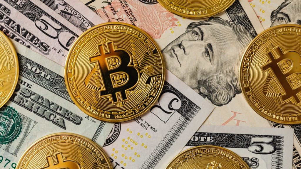 bitcoins-and-us-dollars-1024x576.jpg