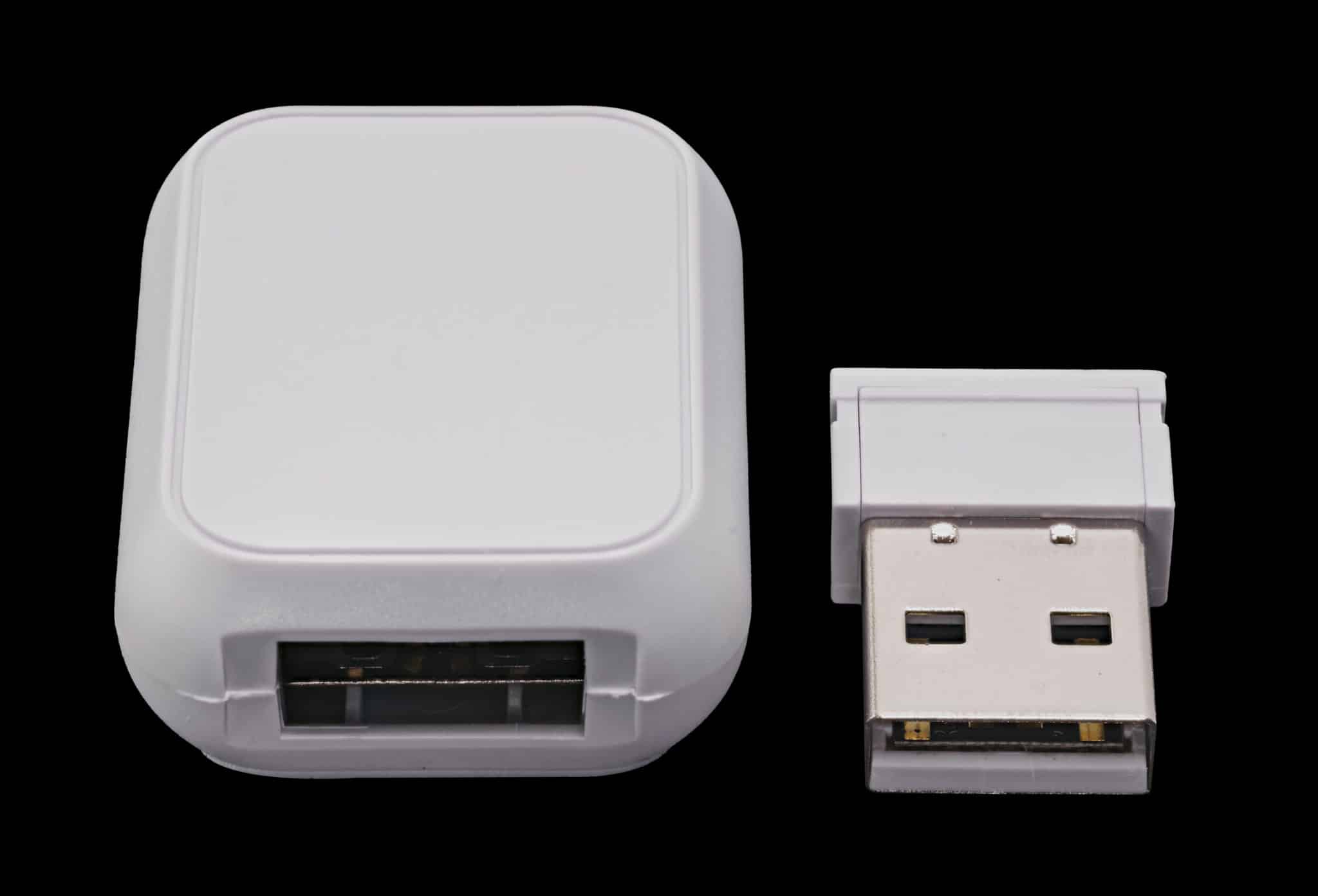 Glorious Model O- Wireless cable coupler and wireless dongle side by side