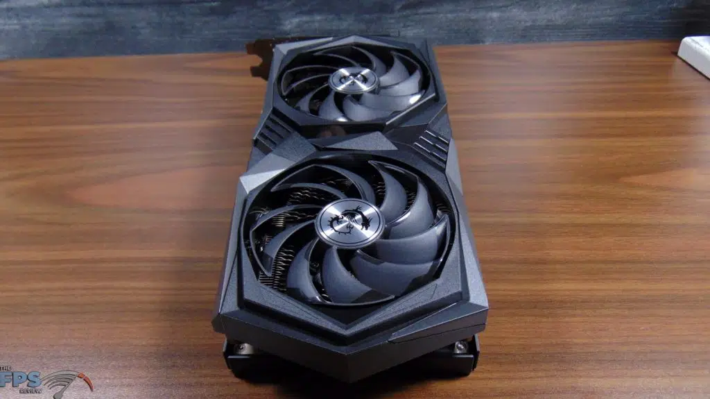 MSI GeForce RTX 3050 GAMING X Video Card Laying On Table Bottom End Top View