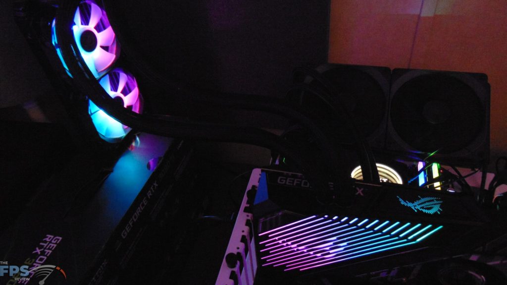 ASUS ROG STRIX LC RTX 3080 Ti O12G GAMING video card installed in computer running with RGB lit up in the dark