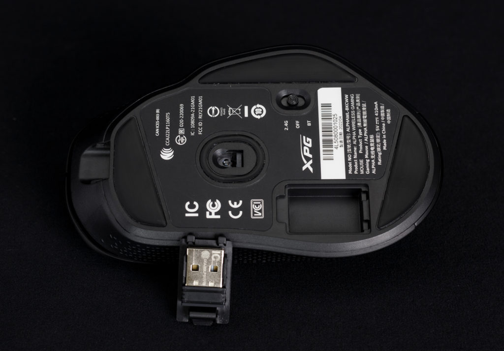 XPG ALPHA Wireless mouse bottom with dongle stowage opened